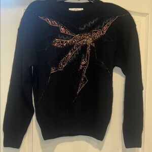 Black Sweater with Embellished Bow Design